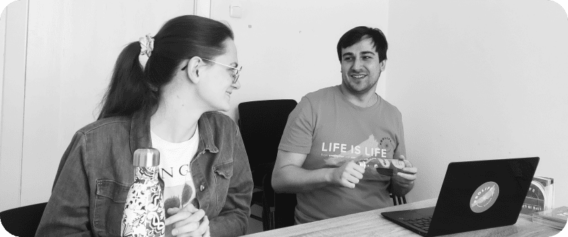 Black and white photo of Benjamin conducting a training session with a new group member