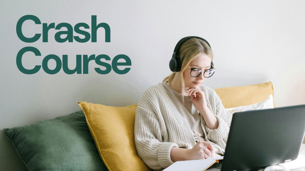 Crash Course event cover, featuring a girl wearing glasses and headphones working on a laptop